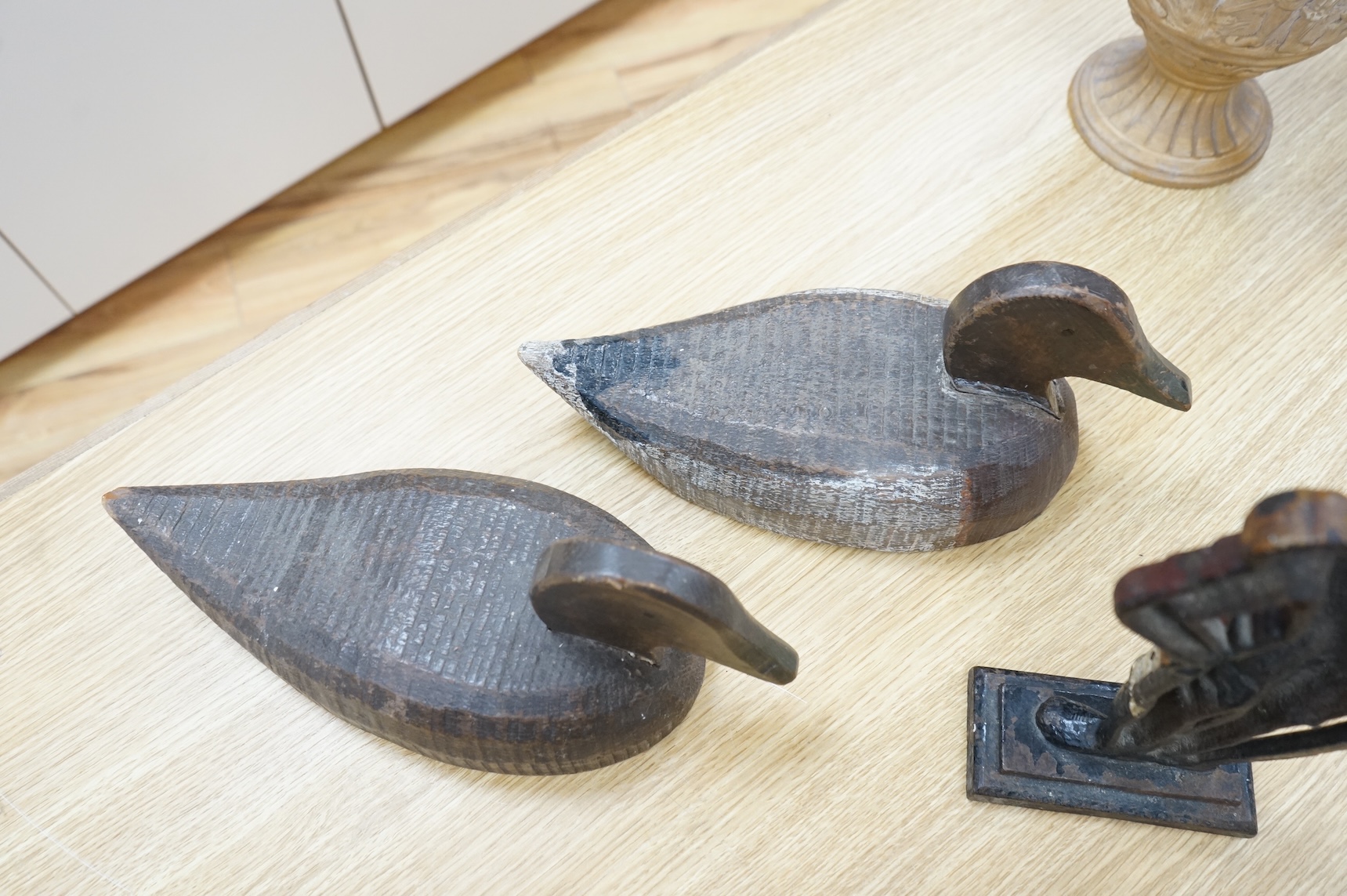 A cast iron ‘Admiral’ door-stop and two wooden decoy ducks, door stop 35cm high